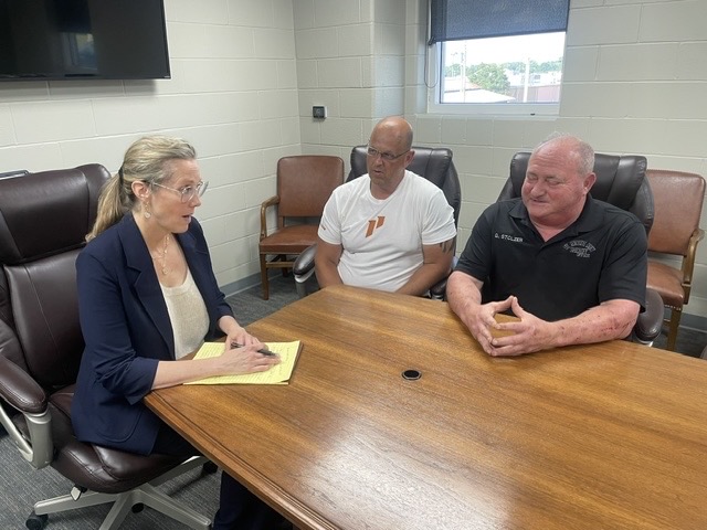 Elizabeth Sparks-Holmes meeting with Sheriff Gary Stolzer and Major Jason Schott during her oversight visit to the Ste. Genevieve County Jail